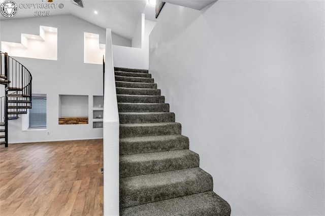 855 5th St, Penrose, CO 81240 - stairway with built in features, vaulted ceiling, and wood finished floors