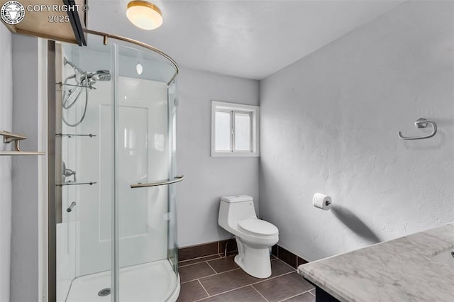 855 5th St, Penrose, CO 81240 - full bath with a shower stall, toilet, and baseboards
