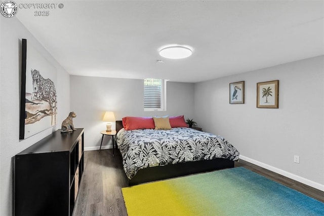 bedroom with dark wood-type flooring