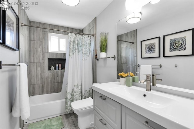 full bathroom featuring shower / bath combination with curtain, vanity, and toilet