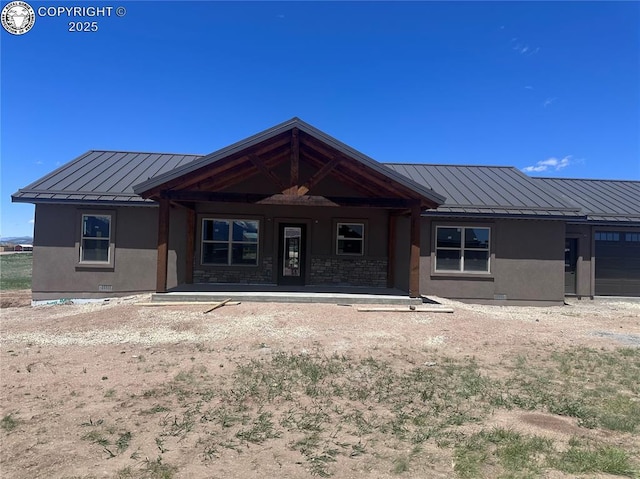 55 Kryptonite Ct, Westcliffe, CO 81252 - rear view of property with a standing seam roof, a metal roof, stucco siding, a garage, and a porch