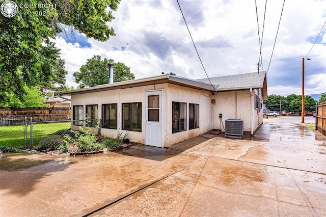 1035 Ohio Ave, Canon City, CO 81212 - rear view of property with stucco siding and a patio