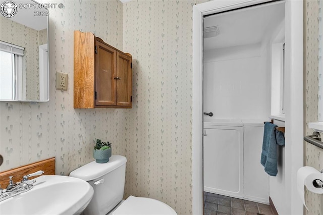 1035 Ohio Ave, Canon City, CO 81212 - bathroom featuring wallpapered walls and tile patterned floors