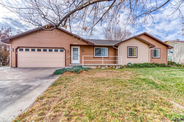 ranch-style home with a garage and a front yard