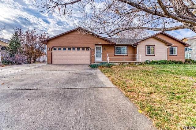 single story home featuring a garage and a front lawn