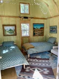 bedroom with wooden walls