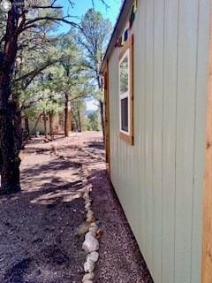 view of side of property featuring an outbuilding