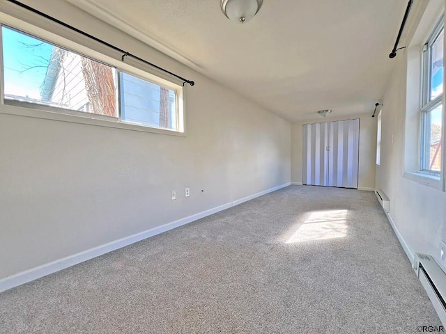 spare room with a baseboard heating unit