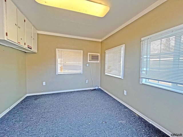 spare room with carpet flooring and a wall mounted AC