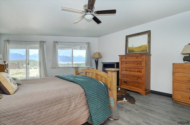 bedroom with hardwood / wood-style floors and ceiling fan