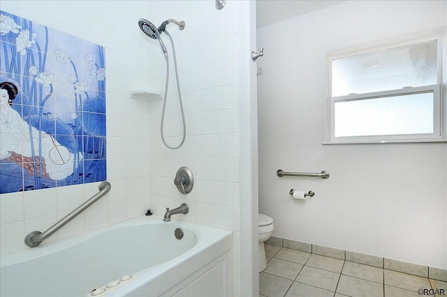 bathroom with tiled shower / bath, tile patterned floors, and toilet