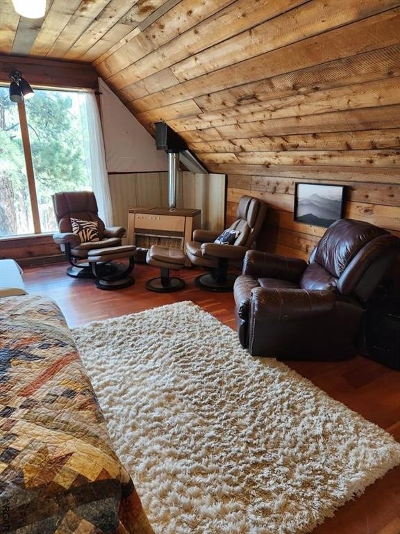 interior space with wood ceiling, lofted ceiling, and hardwood / wood-style floors