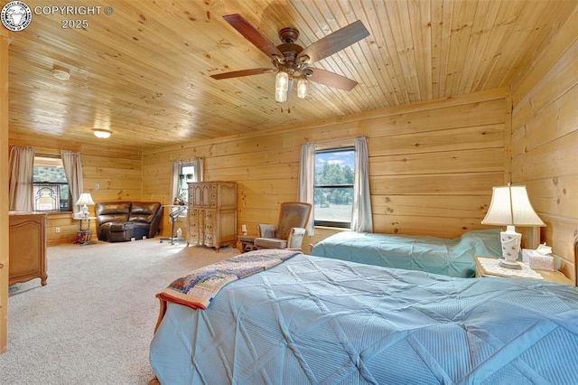 bedroom with wooden ceiling, carpet flooring, and wood walls