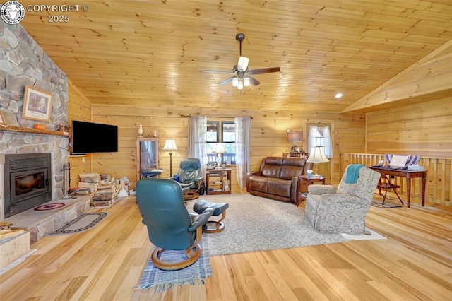 living area featuring ceiling fan, wood ceiling, wood finished floors, and vaulted ceiling