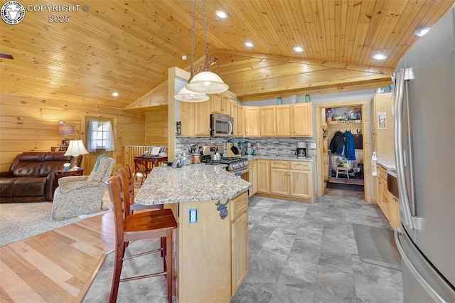 kitchen with light brown cabinetry, open floor plan, appliances with stainless steel finishes, a peninsula, and wood ceiling