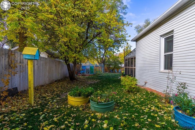 view of yard with a fenced backyard