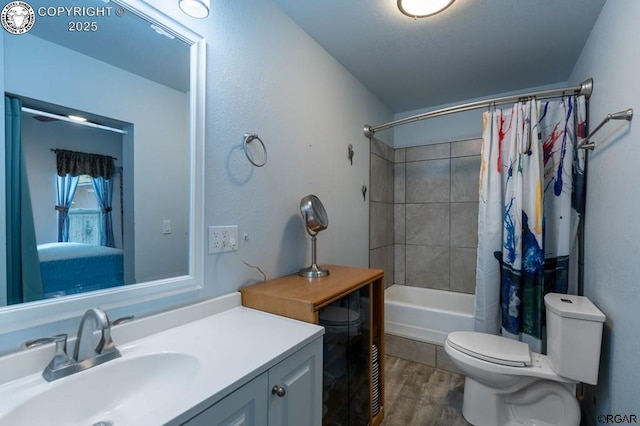 full bath with toilet, shower / tub combo with curtain, wood finished floors, and vanity