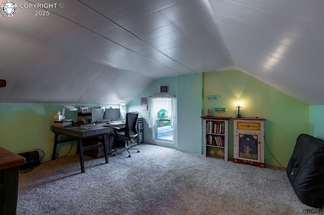 office with lofted ceiling and carpet