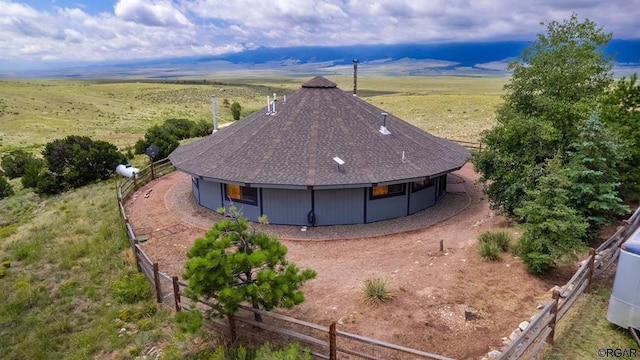 birds eye view of property with a rural view