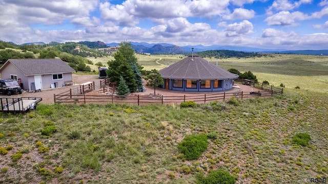 bird's eye view featuring a mountain view and a rural view