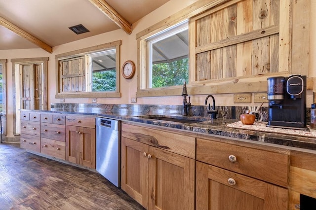 kitchen with dark wood-type flooring, stainless steel dishwasher, sink, and beamed ceiling