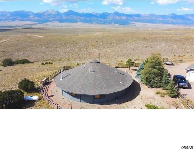 drone / aerial view featuring a mountain view