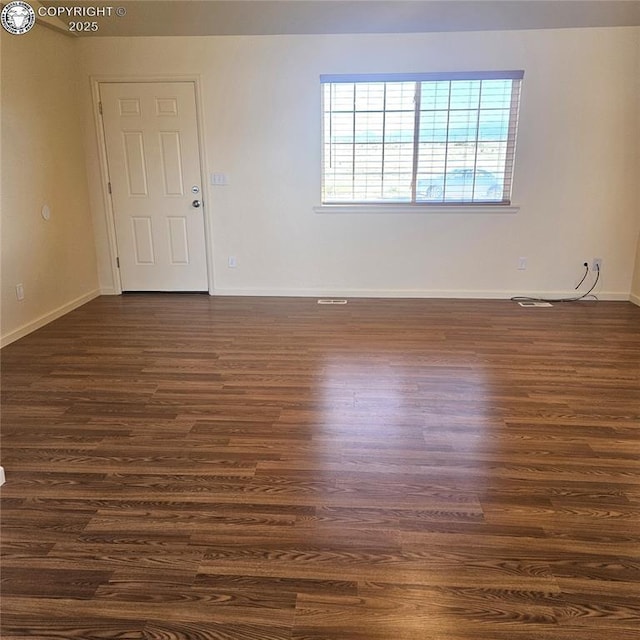 600 Pioneer Ln, Florence, CO 81226 - spare room featuring baseboards and dark wood-style flooring