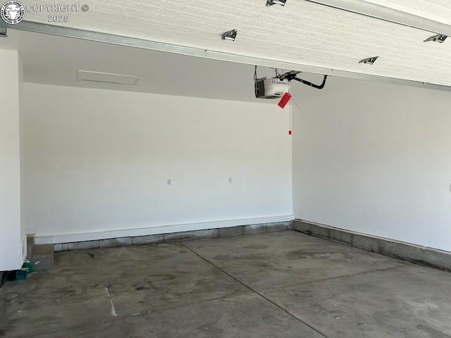 600 Pioneer Ln, Florence, CO 81226 - garage featuring a garage door opener