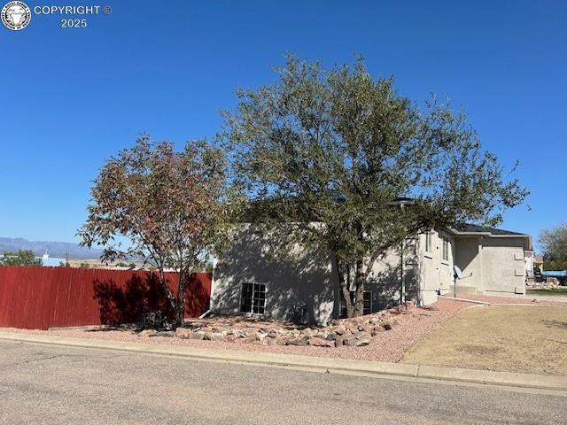 600 Pioneer Ln, Florence, CO 81226 - view of front of house with stucco siding and fence