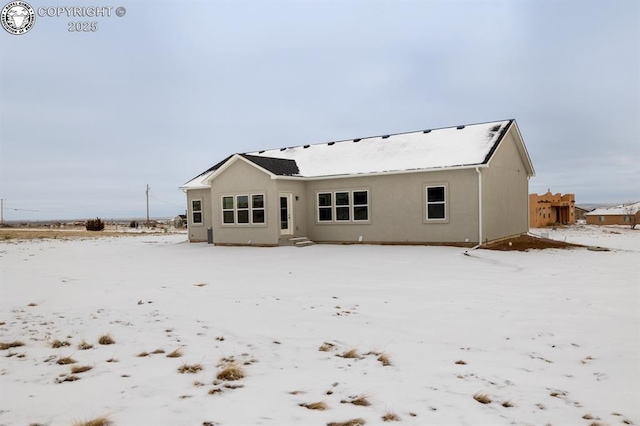 view of snow covered house