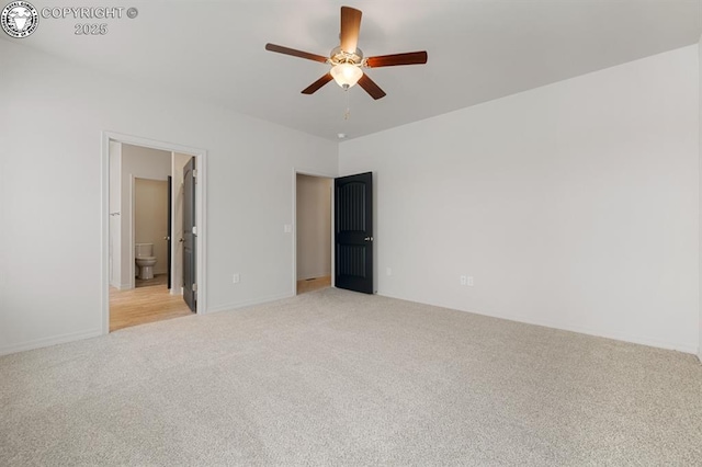 unfurnished bedroom featuring light carpet, ensuite bath, and ceiling fan