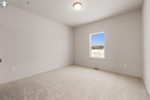 spare room with carpet floors