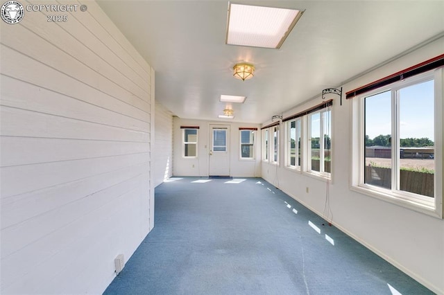 1108 Fairview Ave Unit B, Canon City, CO 81212 - unfurnished sunroom with carpet and wood walls