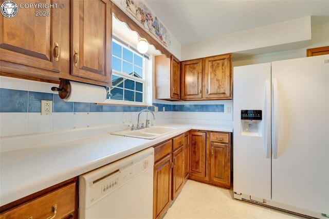 1108 Fairview Ave Unit B, Canon City, CO 81212 - kitchen with white appliances, brown cabinetry, and light countertops