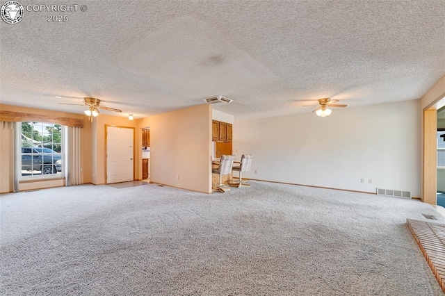 1108 Fairview Ave Unit B, Canon City, CO 81212 - unfurnished living room with a ceiling fan, light colored carpet, and a textured ceiling