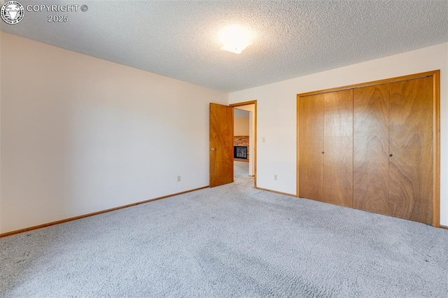 1108 Fairview Ave Unit B, Canon City, CO 81212 - unfurnished bedroom featuring carpet floors, a closet, and a textured ceiling