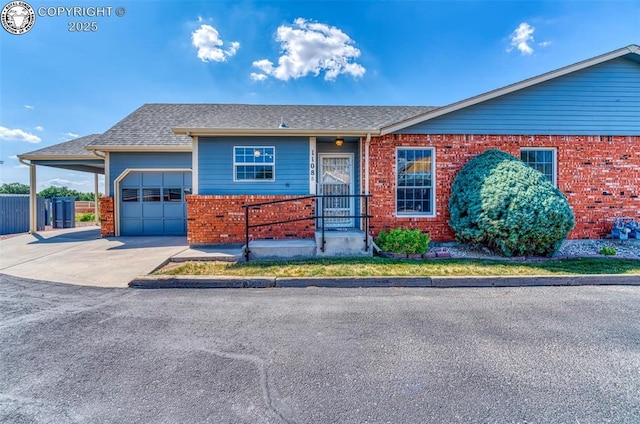 1108 Fairview Ave Unit B, Canon City, CO 81212 - view of front facade featuring brick siding, a garage, driveway, and roof with shingles