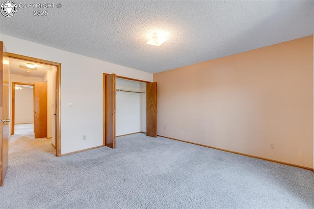 1108 Fairview Ave Unit B, Canon City, CO 81212 - unfurnished bedroom featuring light carpet, a textured ceiling, and a closet