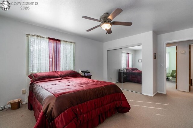 carpeted bedroom featuring a closet and ceiling fan