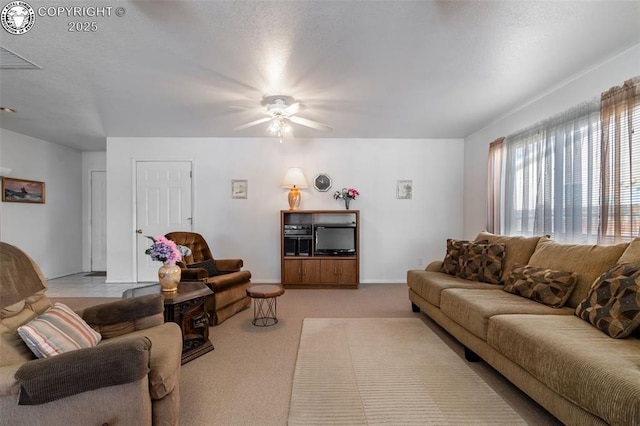 living room featuring light carpet and ceiling fan