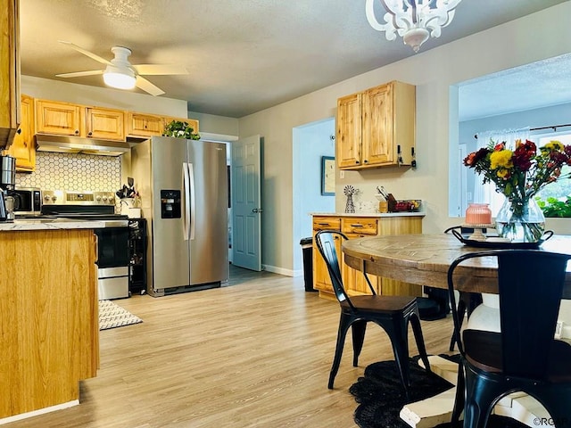 kitchen with light hardwood / wood-style flooring, light brown cabinets, ceiling fan, stainless steel appliances, and decorative backsplash