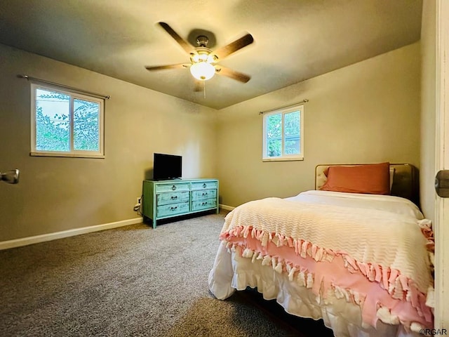 bedroom featuring multiple windows, carpet, and ceiling fan