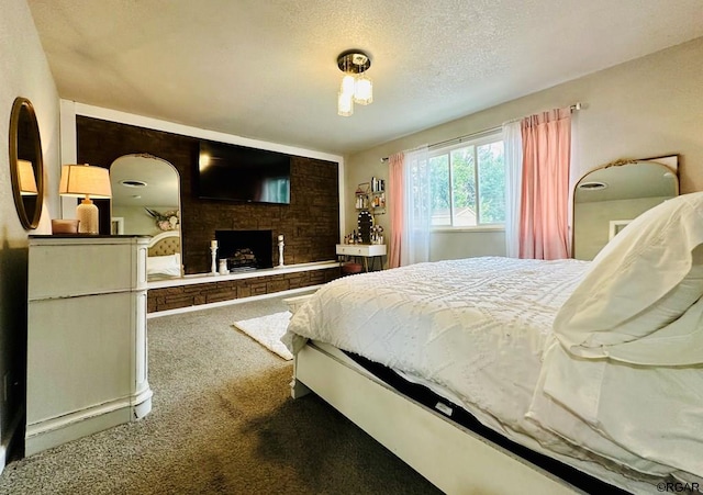 carpeted bedroom featuring a textured ceiling