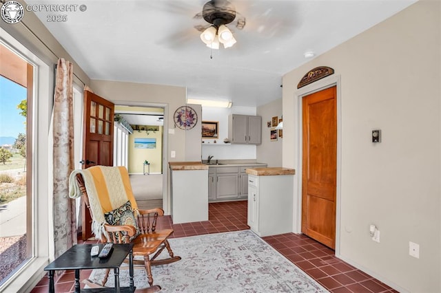 925 2nd St, Penrose, CO 81240 - kitchen featuring light countertops, a ceiling fan, and dark tile patterned floors