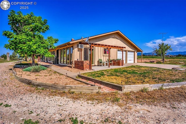 925 2nd St, Penrose, CO 81240 - back of house with driveway, a garage, and brick siding