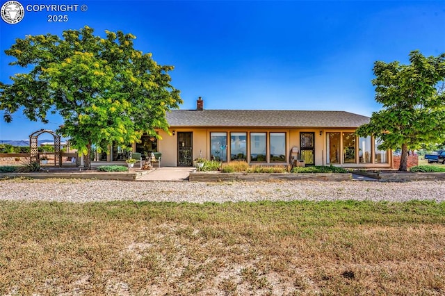 925 2nd St, Penrose, CO 81240 - rear view of house with a chimney, a yard, and roof with shingles