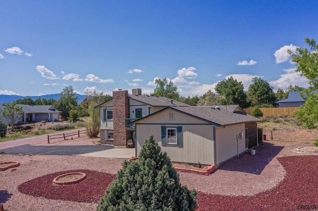 view of front of property featuring a patio and a mountain view