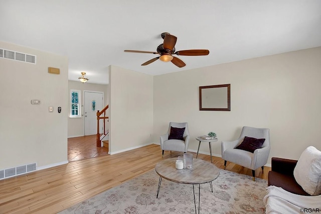 sitting room featuring ceiling fan and light wood-type flooring