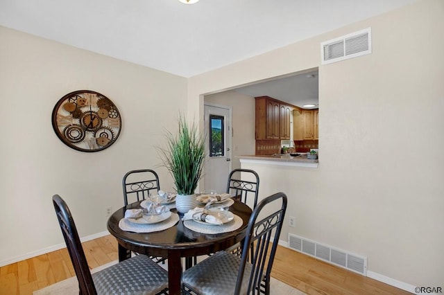 dining area with light wood-type flooring