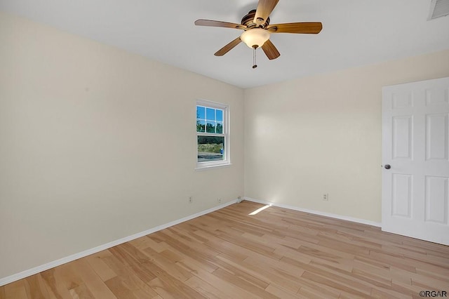 empty room with ceiling fan and light wood-type flooring